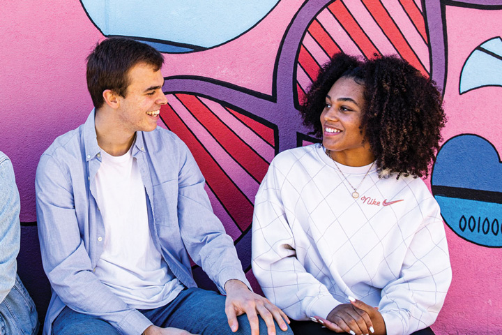 Students in front of SLU mural