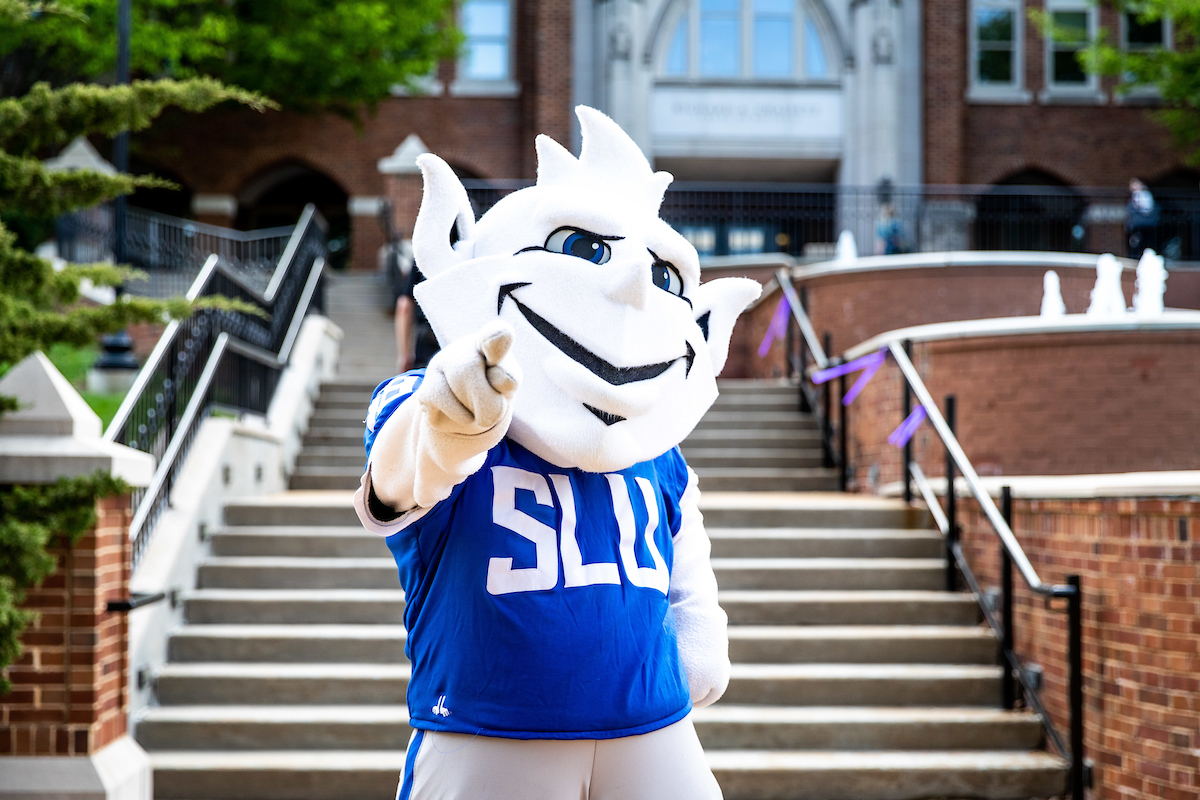 Billiken pointing at camera