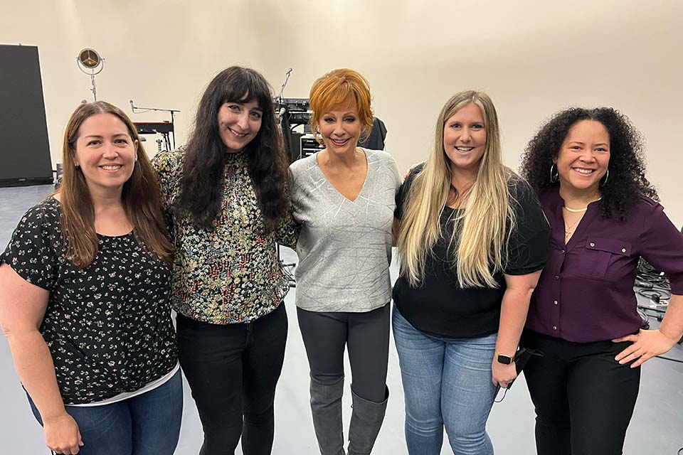Leah (Ducey) Dougherty with Reba and three others.