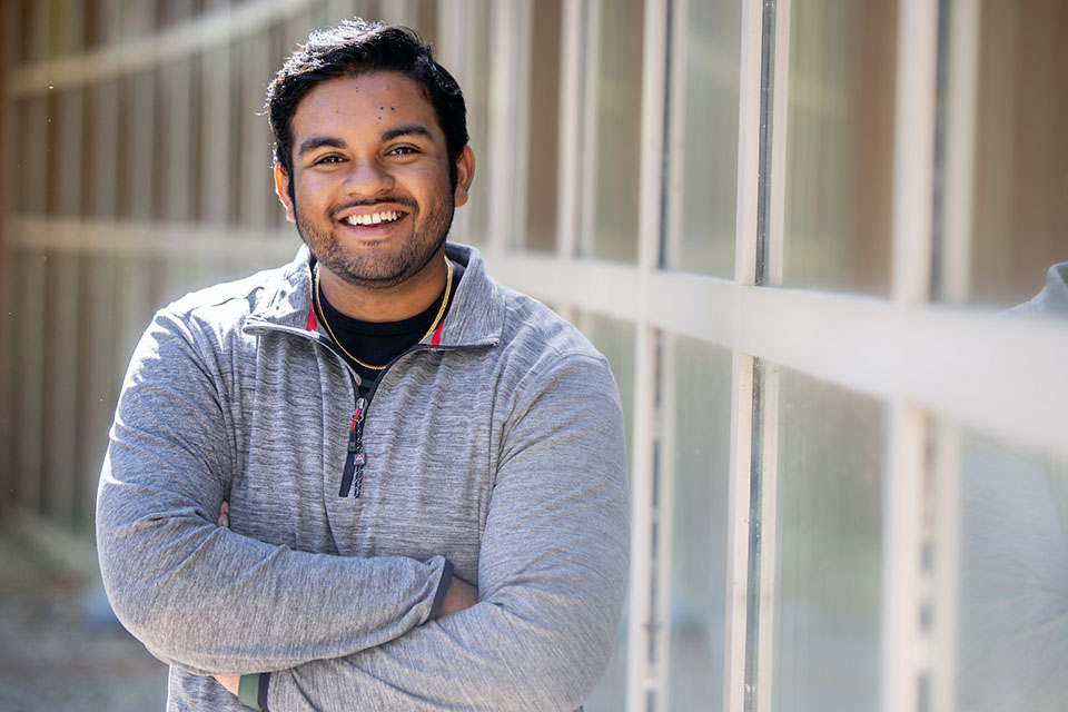 Miit Shah poses for a photo outside on campus.