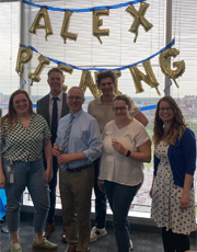 Alex Piening celebrtates a successful dissertation defense with faculty and colleagues