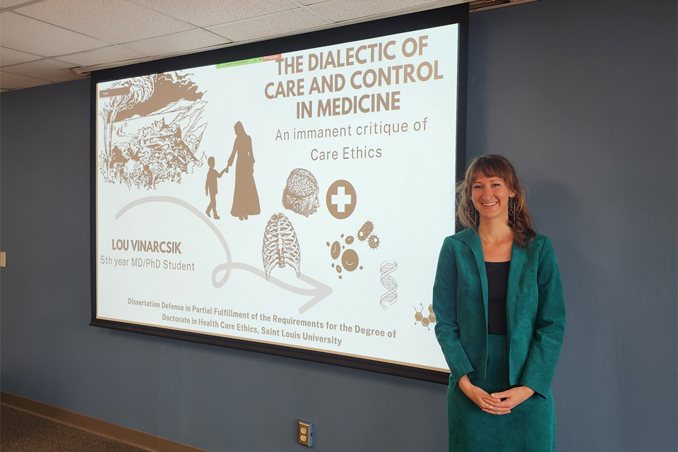 Lou Vinarcsik defending her dissertation in the Health Care department