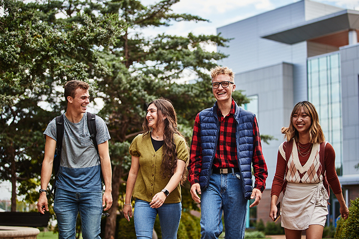 Students walking by the Interdisciplinary Science and Engineering Building