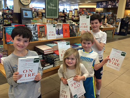 O'Leary children with copies of On Fire book in a bookstore O'Leary children with copies of On Fire book in a bookstore